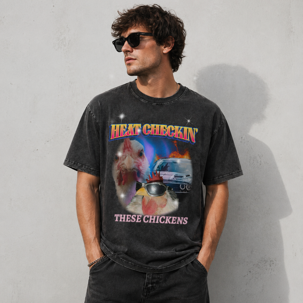 Male model wearing Heat Checkin' These Chickens oversized graphic tee in black by THE 199X